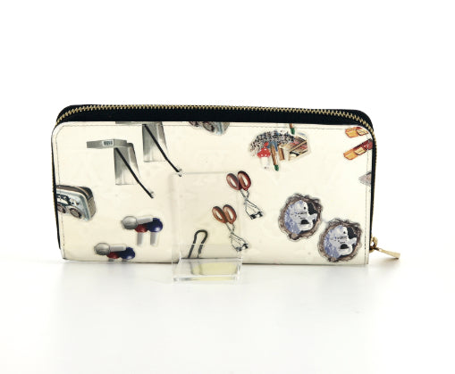 Portafogli Louis Vuitton Zippy in tela monogram cerata color crema con motivo