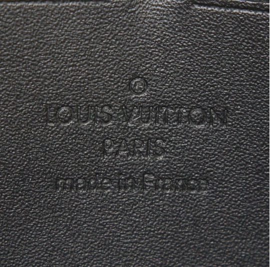 Portafogli Louis Vuitton Zippy in tela monogram cerata color crema con motivo