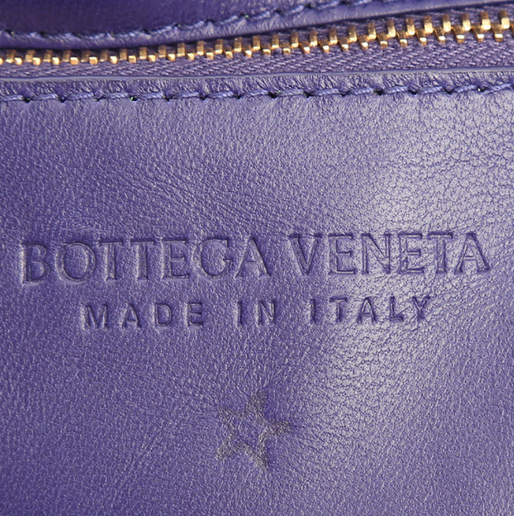 Borsa a tracolla Bottega Veneta Cassette in pelle intrecciata viola